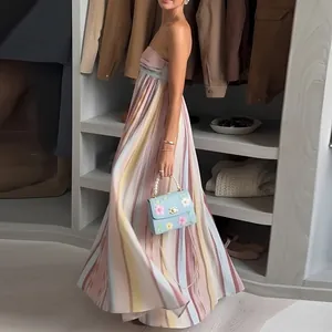 Detail of colorful macaron vertical stripes on an elegant strapless floor-length maxi dress