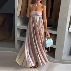 Elegant strapless maxi dress with vertical multi-color stripes and a flowing pleated skirt