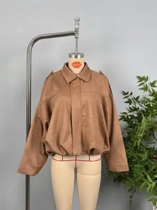 Detail of camel faux suede bomber jacket with lapel collar and elasticated waist band