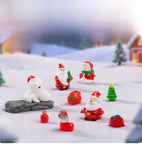 Miniature resin Christmas figurines featuring Santa, snowman and polar bear on snow