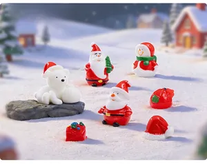 Detailed view of resin Christmas figurines including Santa and snowman on a snow background