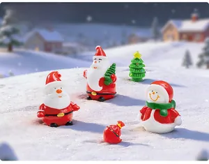 Detailed close-up of resin Christmas miniatures featuring Santa, snowman, and tree on snow