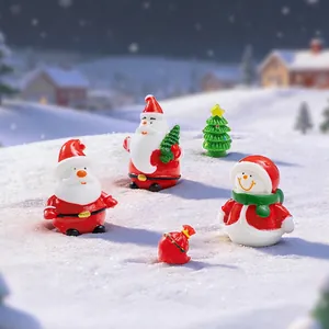 Miniature Christmas resin figurines set including Santa, snowman, tree and gift bag