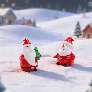 Miniature resin Santa Claus figurines with a Christmas tree for festive micro-landscapes