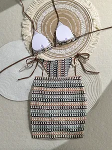 Detailed flat lay of crochet bikini top and mini skirt with bohemian wave pattern