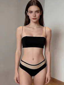 Detail of black wireless bralette set featuring ultra-thin straps and mesh waistband