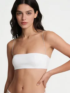 Close-up of white bandeau top featuring ultra-thin shoulder straps and seamless fabric