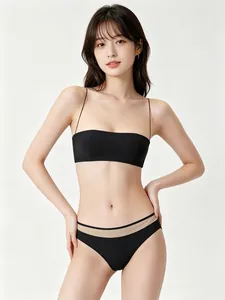 Detail of black seamless bra set with ultra-thin straps and sheer mesh waistband