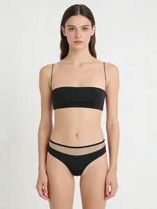 Front view of black lingerie set featuring ultra-thin straps and sheer mesh paneling