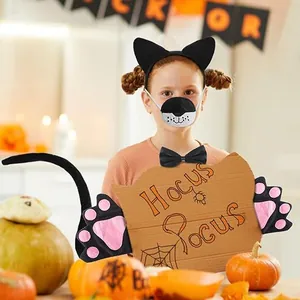 Detail of children black cat costume set with ears headband, tail, and paw gloves