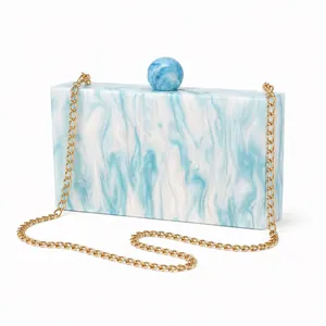 Blue marble acrylic evening clutch bag with gold chain and spherical clasp for weddings