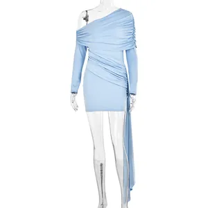 Detail of light blue one-shoulder ruched mini dress with elegant hanging ribbon side detail