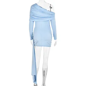 Detail of light blue one-shoulder dress featuring elegant draping and pleated sleeve texture