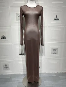 Detail of sheer brown mesh fabric texture on long sleeve slim fit maxi dress