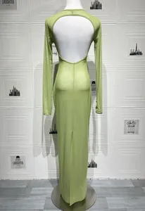 Detail of light green mesh dress showing slim fit silhouette and open back design