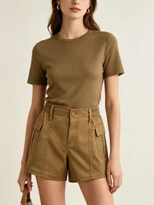 Detail of high-waisted cargo shorts with elastic waist and large flap pockets