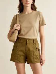 Detail view of women's cargo shorts with functional side flap pockets and elastic waistband