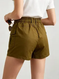 Rear view of olive green cargo shorts featuring elastic waist and large flap pockets