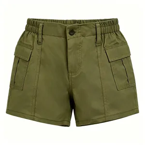 Detail of army green cargo shorts featuring elastic waist and large flap utility pockets