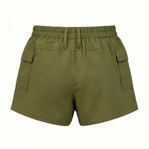Detail view of the elastic waistband and cargo pockets on army green utility shorts