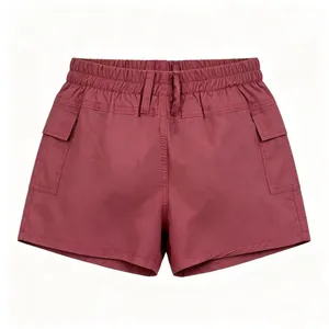 Detailed view of dark red cargo shorts featuring elastic high waist and large utility pockets
