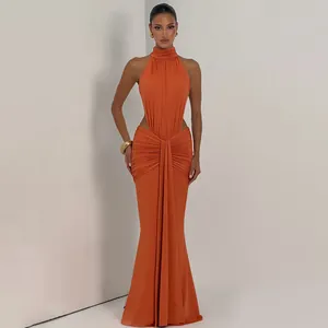 Elegant orange halter neck maxi dress with side cut-outs and ruched mermaid silhouette