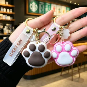 Cute silicone cat paw keychain with Lucky Day wrist strap and gold metal clasp