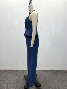 Detail of navy blue striped peplum camisole and matching denim straight leg trousers