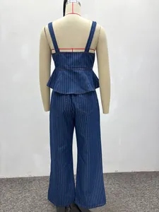 Back view of dark blue striped denim set featuring ruffled crop top and wide-leg trousers