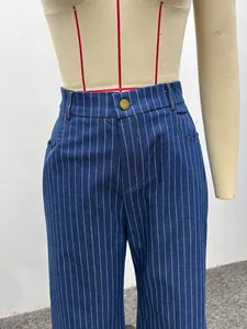 Detailed close-up view of stylish high-waist blue vertical striped denim pants