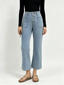Detail view of high waist light blue denim jeans with four vintage button fly and pockets