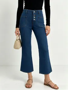 High-waist deep blue flare jeans with four vertical metal buttons and front patch pockets