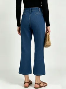 Rear view of high-waisted wide-leg denim jeans in dark blue with classic back pockets