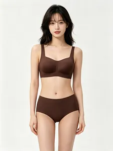 Front view of a dark brown seamless square neck bra set with soft support on a model