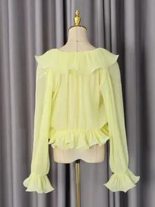 Yellow ruffled long-sleeve blouse featuring pleated chiffon fabric and a romantic waistline