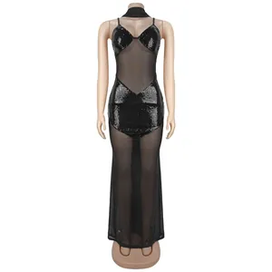 Detail of black sequins and sheer mesh fabric on a sexy V-neck bodycon maxi dress