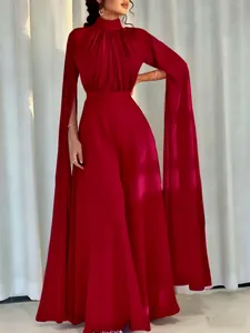 Detailed view of dark red satin jumpsuit with pleated high neck and extra long slit sleeves