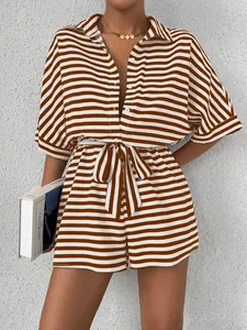 Detail of brown and white striped summer romper featuring a collar and button placket