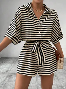 Close-up of striped short sleeve shirt and belted shorts set with button-down collar