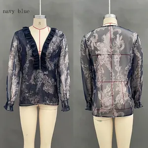 Detailed view of navy blue sheer paisley chiffon top with deep V-neck and ruffled edges