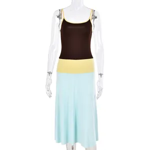 Detail of color-block knit maxi dress featuring brown, yellow, and blue panels