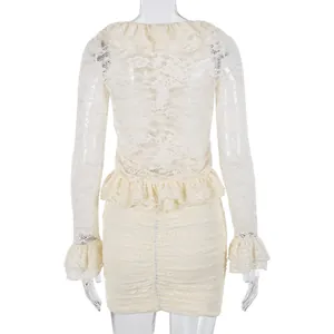 Detail of cream lace two-piece set with ruffled long sleeves and ruched mini skirt