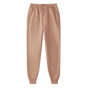 Men's and women's casual fleece joggers in dusty pink with drawstring elastic waist