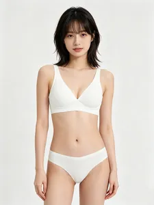 Detailed view of seamless white wireless triangle bra and thong set on a model