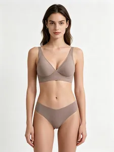 Detailed close-up of seamless V-neck wireless bra and high-waisted thong set in taupe