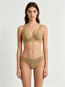 Close-up of seamless nude V-neck bra and thong set with soft elastic fabric texture