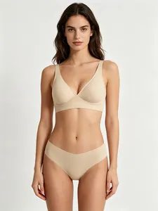 Detail showing the seamless skin-colored V-neck bra and matching panties set