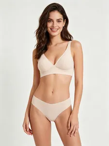 Detail of seamless beige lingerie set showing V-neck wireless bra and matching panties