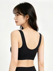 Detail of seamless black V-neck bra showing deep U-shaped back and wide shoulder straps