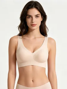 Front view of seamless skin-tone V-neck bralette with wide straps on model